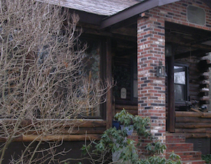 Sliding glass doors in a log cabin