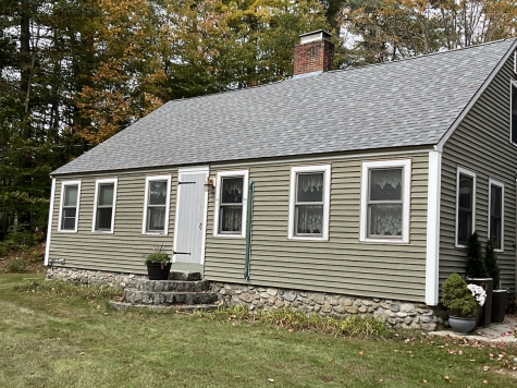 Board storm door on old cape